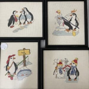 Set of 4 vintage penguin cross stitches.