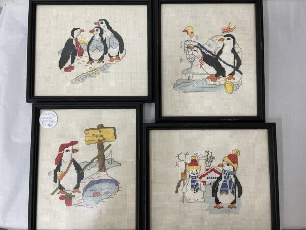 Set of 4 vintage penguin cross stitches.
